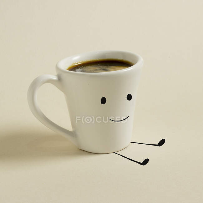 Tasse de café avec un sourire dessus — Photo de stock