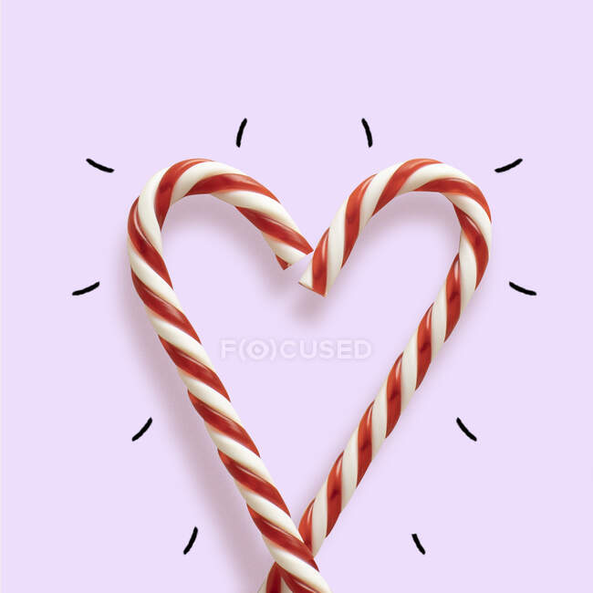 Cuore concettuale fatto di bastoncini di caramelle natalizie — Foto stock