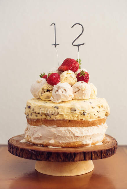 Home made ice-cream birthday cake with birthday sparklers in the number twelve — Stock Photo