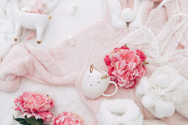 Arrangement of women's lingerie, clothing, peonies and ornaments — Stock Photo