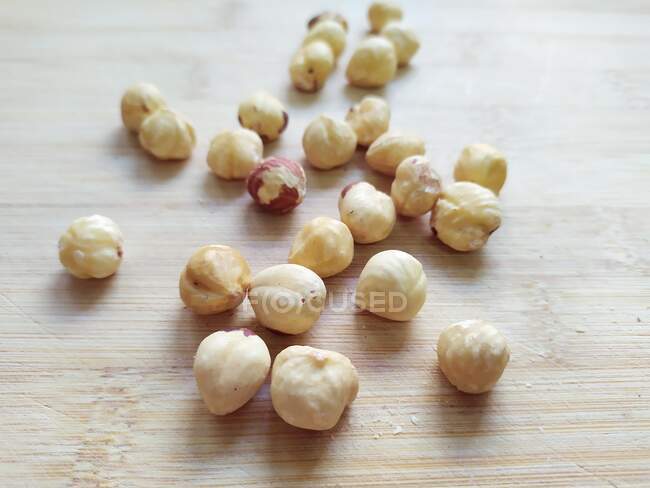 Close-up of hazelnuts on a wooden table — Stock Photo