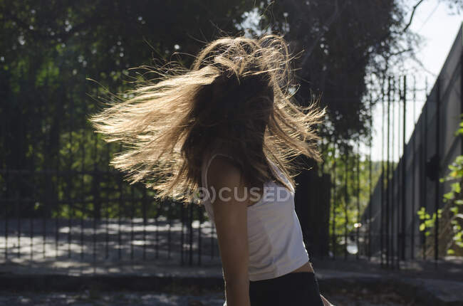 Teenage girl standing in the street spinning around, Argentina — Foto stock