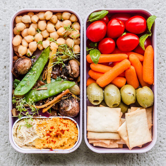 Vegetable and humus lunch boxes — Stock Photo