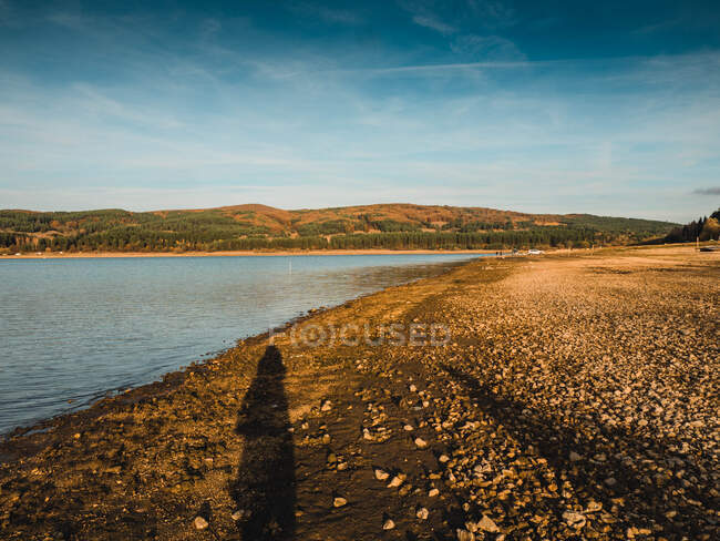 Shadow of a person standing by Iskar Reservoir, Bulgaria — Stock Photo