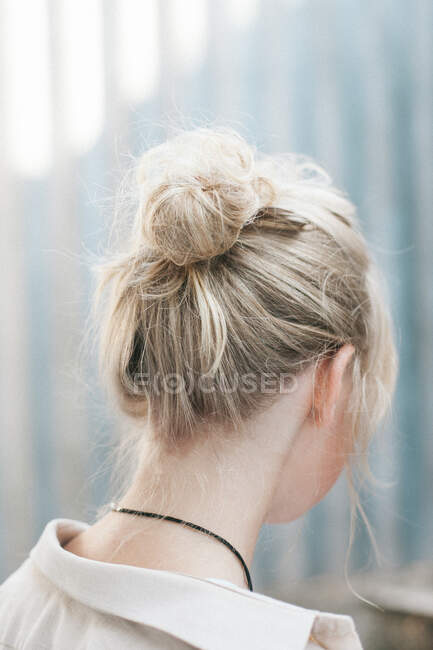 Portrait of a beautiful woman with a hair bun — Stock Photo