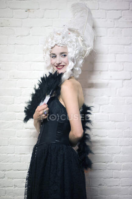 Portrait of a smiling woman wearing 18th century style costume — Stock Photo