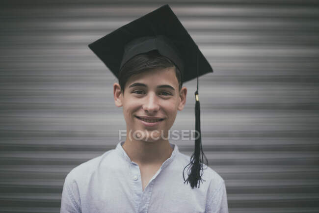 Portrait of a smiling teenage boy at graduation, Spain — Foto stock