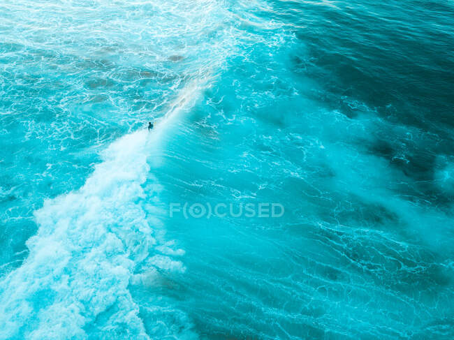 Blue water surface with foam in the sea — Stock Photo
