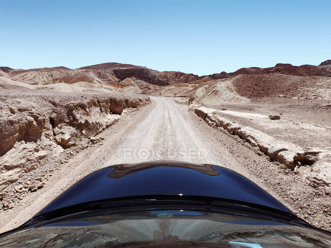 Car driving along a desert road, Death Valley National Park, Nevada, United States — Stock Photo