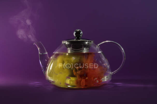 Conceptual tea brewing in a teapot — Stock Photo