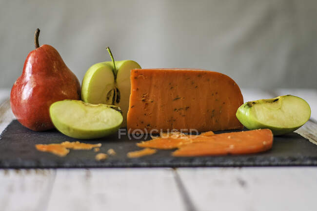 Cheese with apples and pears — Stock Photo