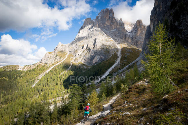Woman Mountain Biking in the Dolomites, Italy — Stock Photo