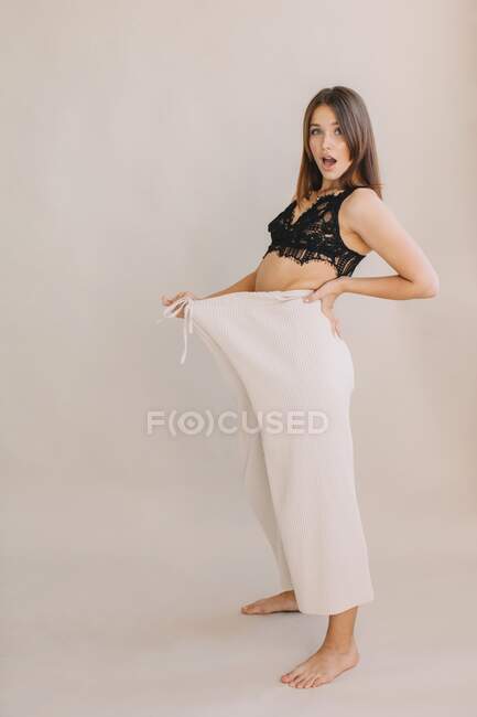 Portrait of a woman wearing loose trousers — Stock Photo
