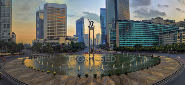 Jakarta cityscape at pretty sunset, Indonesia — стокове фото
