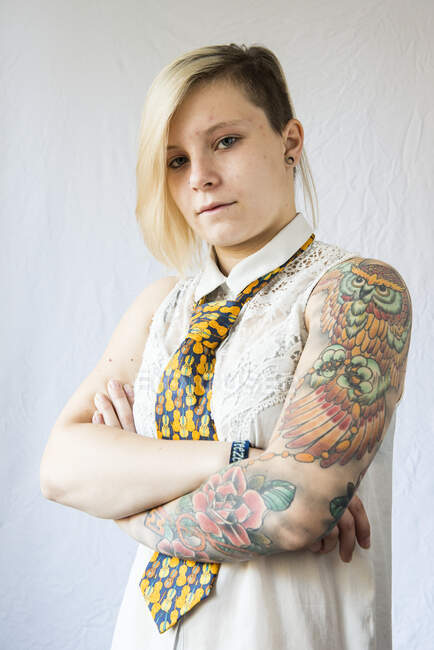 Portrait of a woman with a sleeve tattoo — Stock Photo