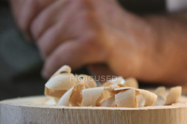Man carving a piece of wood — Stock Photo