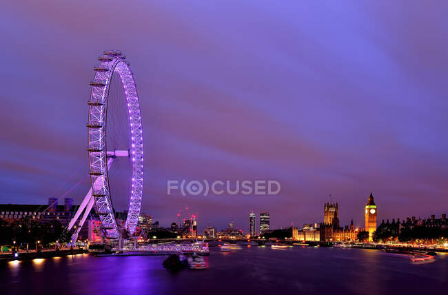 City skyline and London Eye at dusk, London, England, United Kingdom — Stock Photo