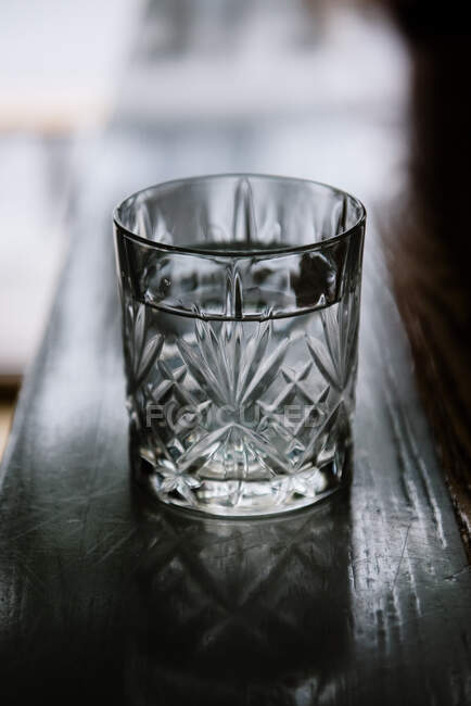 Glass of water on a bar — Stock Photo