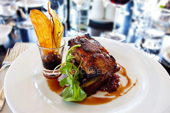 Roasted loin of beef with potato wedges — Stock Photo