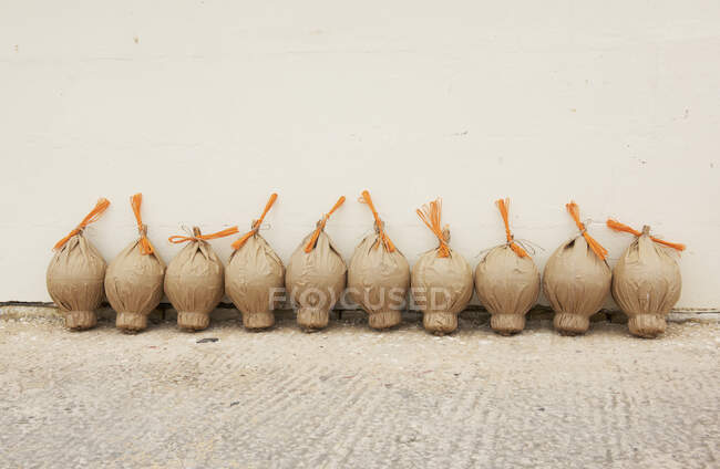 Firework powder bags in a row by a wall, Malta — Stock Photo