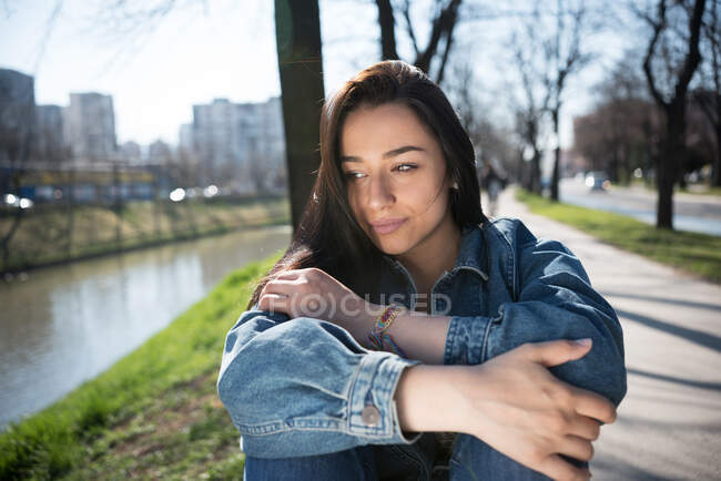 Portrait of a woman sitting by a river, Bosnia and Herzegovina — Stock Photo