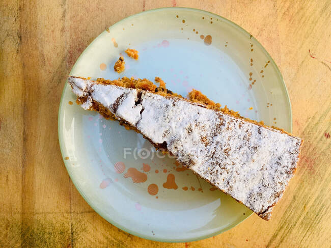 Slice of walnut and carrot cake on a plate — Stock Photo