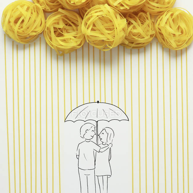 Conceptual couple standing under an umbrella in the rain — Stock Photo