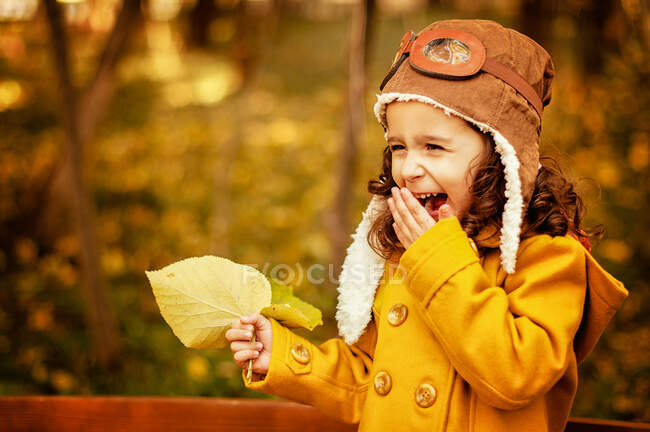 Girl standing in a park laughing, Bulgaria — Stock Photo