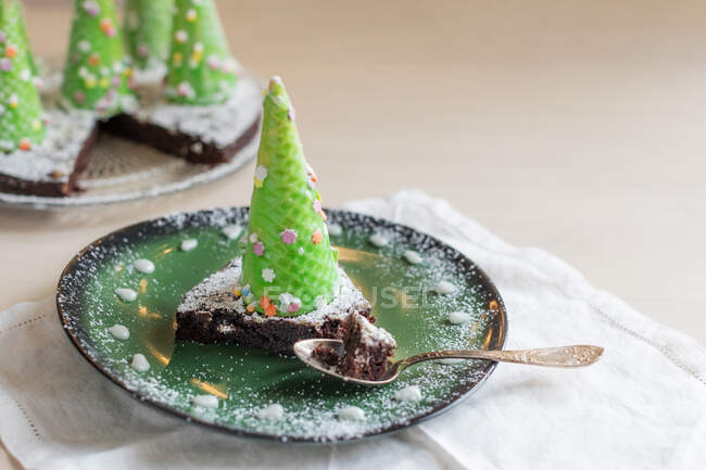 Christmas cake with chocolate and mint on a white background. — Stock Photo
