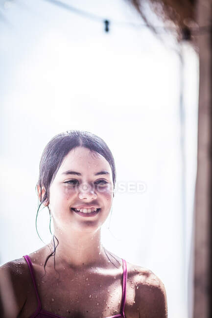 Portrait of a smiling girl standing on beach, Bulgaria — Stock Photo