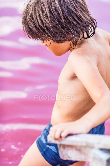 Boy getting into Atanasovsko Lake, Burgas, Bulgaria — Stock Photo