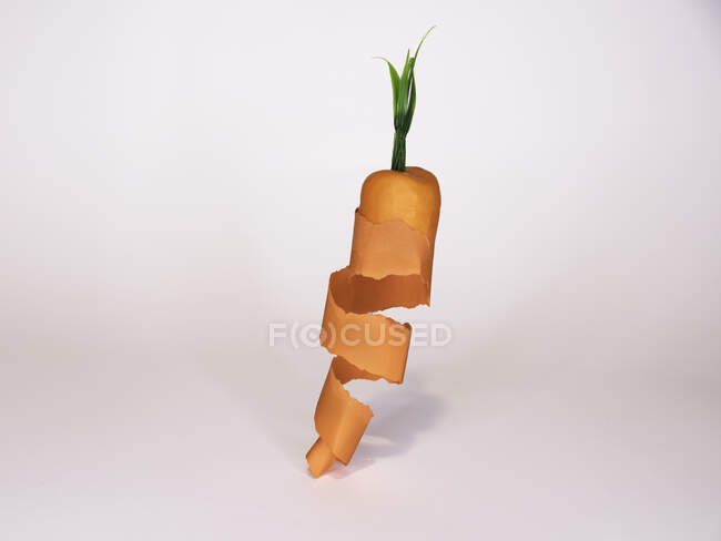 Cut ribbon carrot isolated on white — Stock Photo