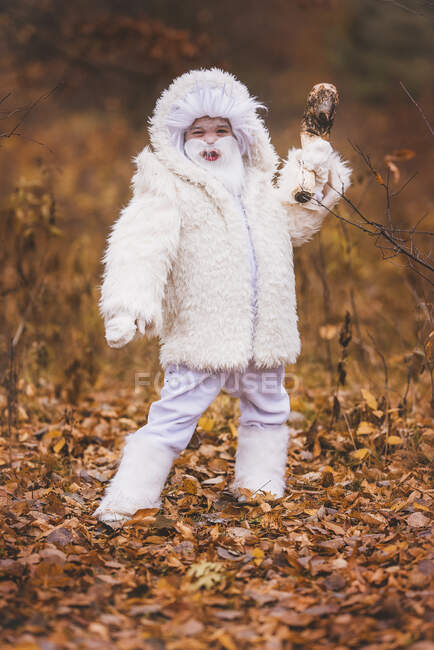 Boy standing in the forest dressed as a yeti for Halloween, United States — Foto stock