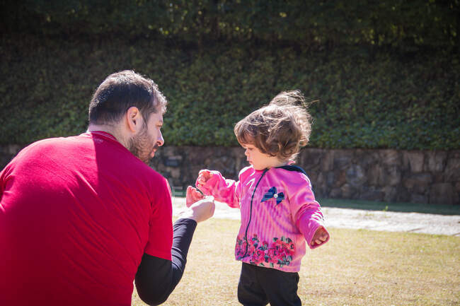 Father and daughter playing in the park, Brazil — Stock Photo