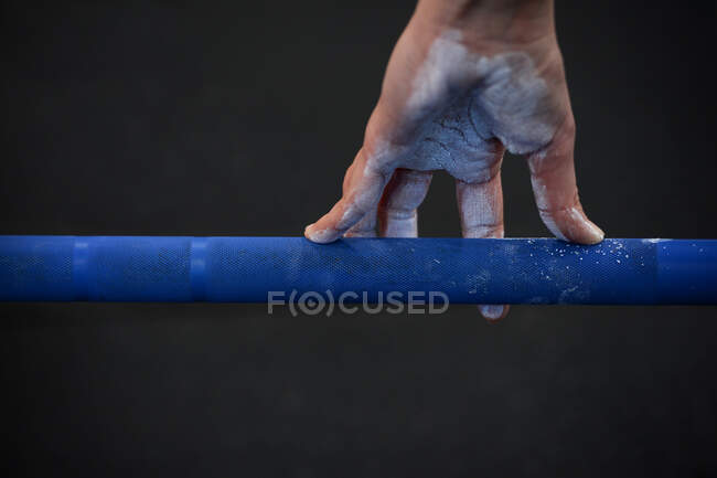 Female hand with talc on a barbell lever — Stock Photo