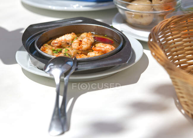 Garlic prawn appetiser on a dinner table — Stock Photo
