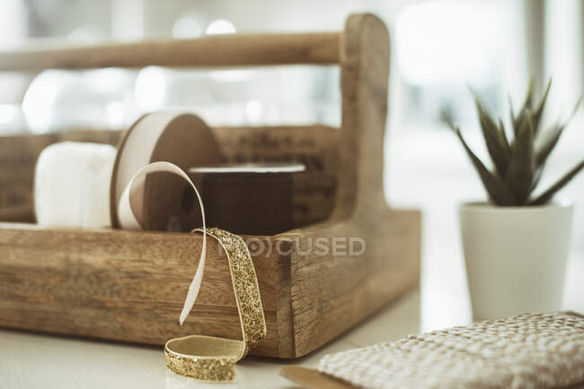 Wooden crate with ribbons skeins, close up — Stock Photo