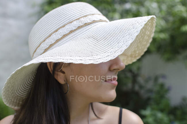 Portrait of a teenage girl wearing a capelin style hat — Stock Photo