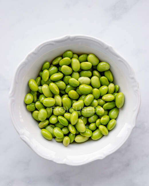 Top view of bowl with shelled edamame beans — Stock Photo