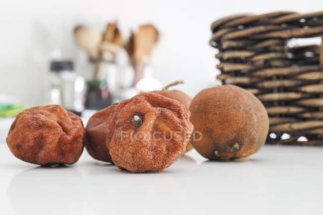 Decomposing tangerines on kitchen table, close up shot — Stock Photo