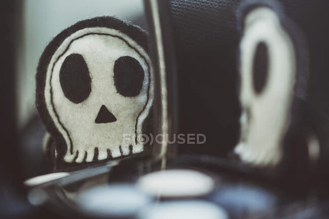 Reflection of a home made felt skull in a mirror for Halloween — Stock Photo