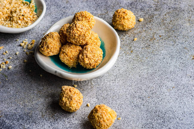 Healthy homemade candy balls coated in chopped nuts — Stock Photo